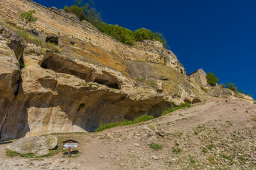 the remains of a medieval fortress city (according to other sources - a monastery) Tepe-Kermen, covering the upper part of the mountain in several tiers