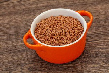 Raw buсkwheat cereal in the bowl