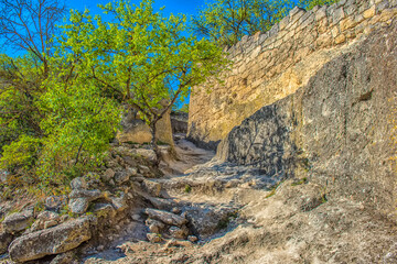 the remains of a medieval fortress city (according to other sources - a monastery) Tepe-Kermen, covering the upper part of the mountain in several tiers