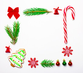 New Year's composition. Frame made of Christmas decorations on a white background. Flat lay
