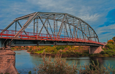 Metal construction of the city bridge on a sunny day in Kungur, Perm krai, Russia.
