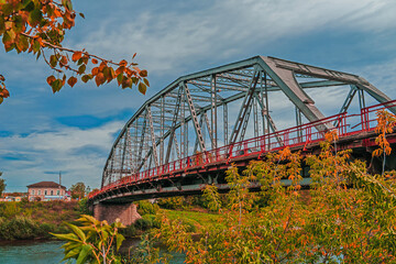 Metal construction of the city bridge on a sunny day in Kungur, Perm krai, Russia.