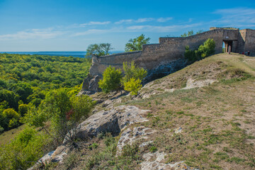 the remains of a medieval fortress city (according to other sources - a monastery) Tepe-Kermen, covering the upper part of the mountain in several tiers