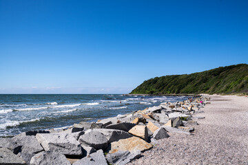 beach with stone wall on the german island hiddensee in the baltic sea