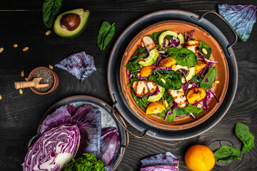 Pieces of chicken fillet with fresh tomatoes, cabbage, spinach and avocado. Proper nutrition. Detox and healthy concept. Keto paleo lunch. Top view