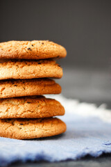 Homemade oatmeal cookies with raisins on a dark background