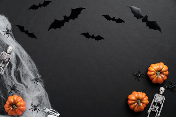 Happy halloween holiday concept. Bats silhouettes, pumpkins, spider web, skeletons, spiders on...