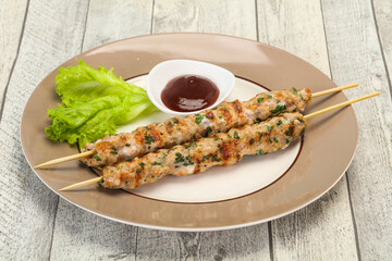 Minced pork skewer kebab with sauce
