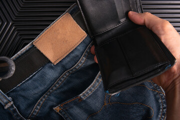 Man pick black wallet from back pocket