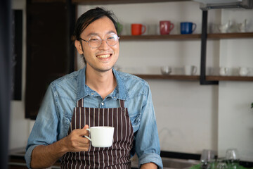 Man standing smile in the morning with red cup of coffee