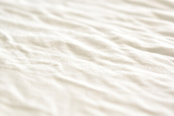 Fototapeta na wymiar Bedding white sheet background. White cotton fabric texture background.