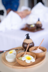 Therapist prepare Honey , milk , powders and oil  for client