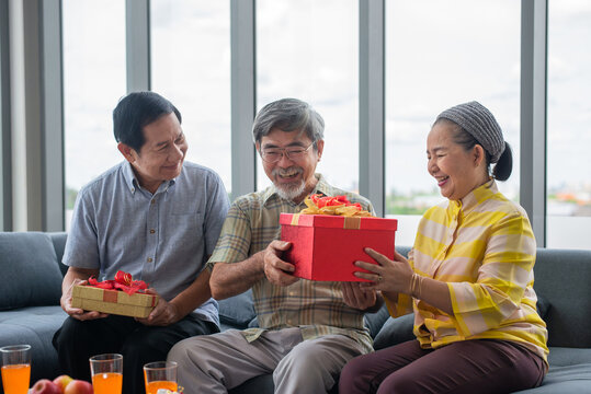 Retired friend recieving present with happiness