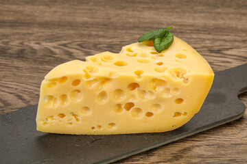 Maasdam cheese - yellow triangle with holes