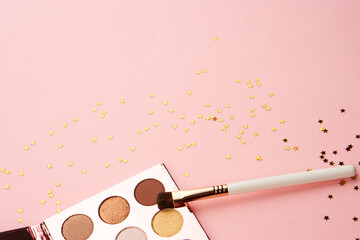 eyeshadow makeup brushes collection professional cosmetics accessories on pink background