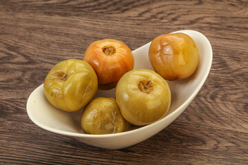 Pickled green tomato in the bowl