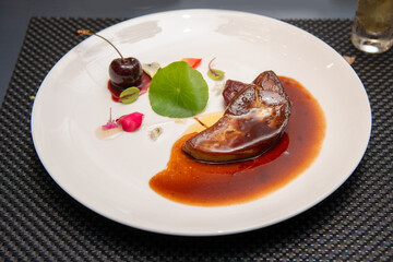 Juicy grilled foie gras fine garnish  with gravy sauce
