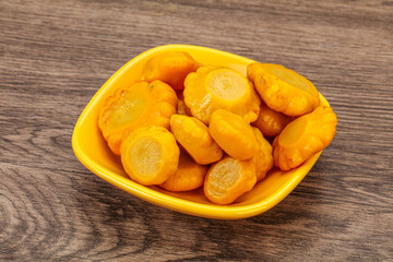Marinated yellow patisson in the bowl