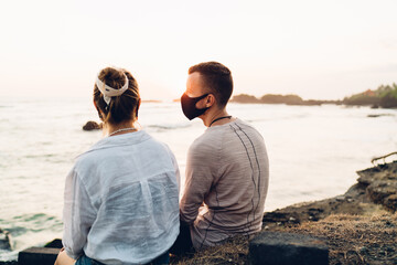 Unrecognizable couple admiring sunset