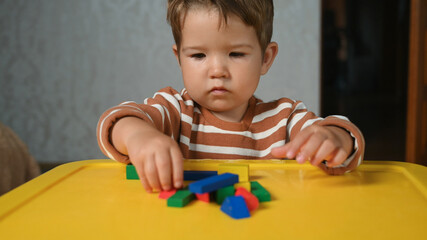 the child develops motor skills with geometric shapes
