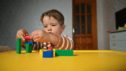 the child develops motor skills with geometric shapes