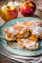 Homemade pancakes on a wooden table.