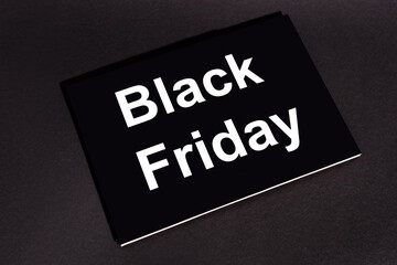 placard with black friday lettering on dark background