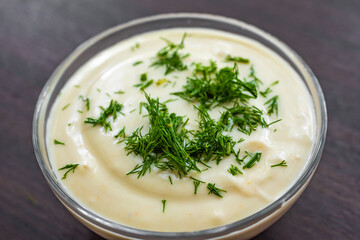 close up photo, homemade vegetarian mayonnaise garnished with dill, healthy and wholesome sauce