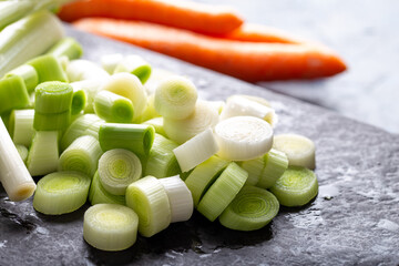 Washed sliced leek. sliced leek on stone cutting board 