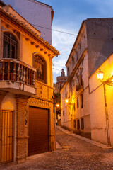 Fototapeta na wymiar Granada - The ascent to Alhambra palace across the old street in morning dusk.
