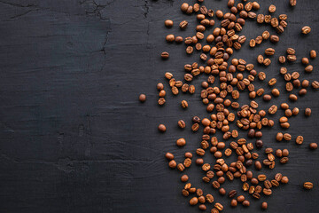 Coffee beans roasted on a black background