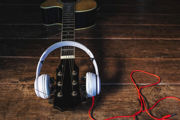Classical guitar and music headphones