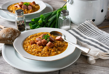 Carrot stew with meat and sausages