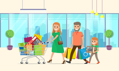 Family does lot of buying in hypermarket. Mom rolls large shopping cart. Dad carries lot of paper bags, girl carries purchased toy or game. Large panoramic shop windows, cityscape in reflection