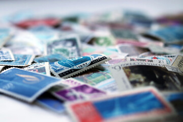 Blurred, defocused, tilt shift multicolored postage stamps collection from different countries...
