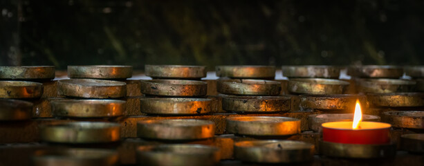 Blurred architecture background of church interior inside old cathedral catholic holy pray god jesus religion with candles 
