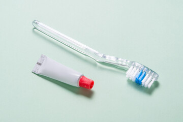 Single use disposable toothbrush with small tube of toothpaste