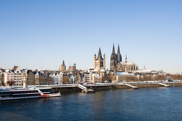 Panorama of the old center and Cathedral of Cologne in winter with snow on roofs