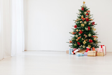 Christmas tree pine with gifts for the new year postcard white gray background decor