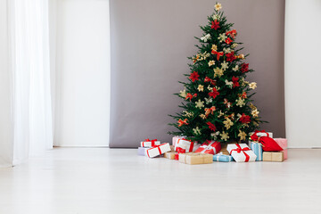 Christmas tree pine with gifts for the new year postcard white gray background decor