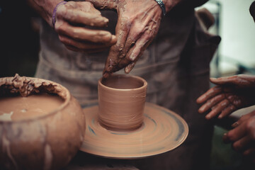 Fototapeta na wymiar close up of hands of a potter 