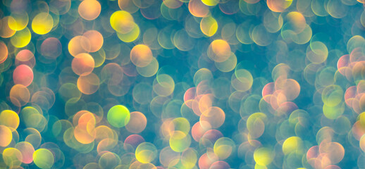 Blue bokeh holiday textured glitter background. Blurred abstract holiday background.