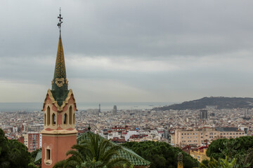 Fototapeta na wymiar A view of the Casa Museo Gaudí and downtown Barcelona from Park Güell
