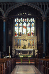 Fototapeta premium Row of empty wooden seats in the house of god, Church indoors