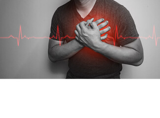 A close-up of a black and white hand in the chest with chest pain from a heart attack. Health care...