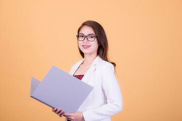 Office worker beautiful asia young woman, on yellow color background with copy space. Human face expressions, emotions feelings, body language,beauty and fashion concept.