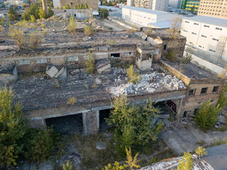 Obraz premium Aerial drone view. The destroyed workshop of the plant.