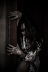 Portrait of asian woman make up ghost face with blood,Horror scene,Scary background,Halloween...