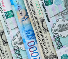 US dollars and Russian rubles, money background. Financial crisis, ruble devaluation concept.