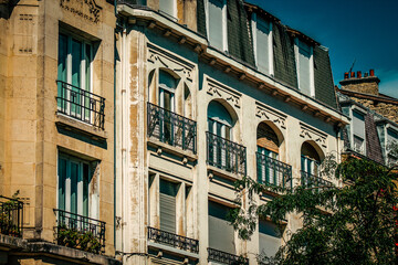 Fototapeta na wymiar View of the facade of a building in the downtown of Reims in France 